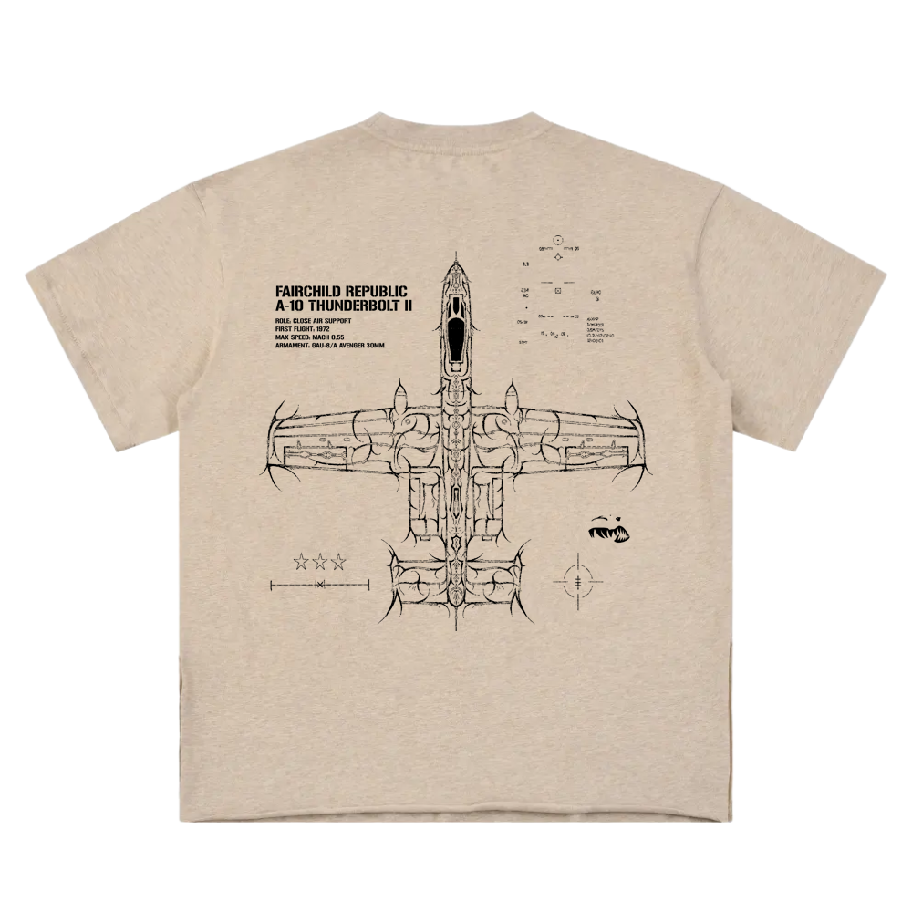 Tan t-shirt with aviation-inspired line art of A-10 Thunderbolt II and technical details on back