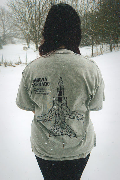 Person in snowy outdoors wearing aviation-inspired t-shirt with Panavia Tornado jet graphic