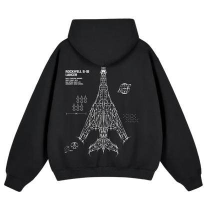 Black hoodie featuring aviation-inspired Rockwell B-1B Lancer bomber schematic graphic on back.