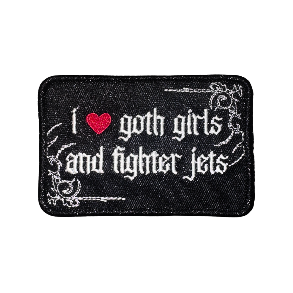 Black embroidered patch with gothic text, red heart, reading 'I love goth girls and fighter jets'