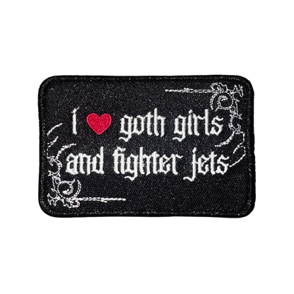 Black embroidered patch with gothic text, red heart, reading 'I love goth girls and fighter jets'
