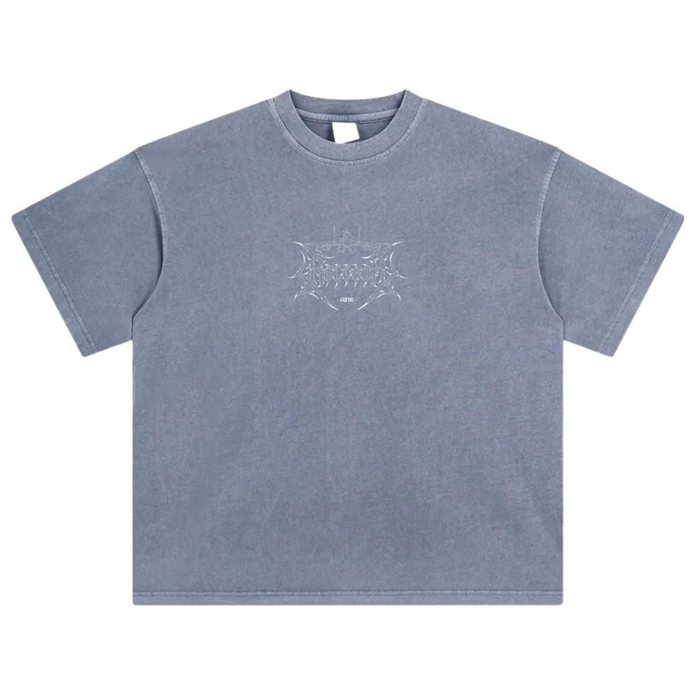 Blue washed oversized t-shirt with aviation-inspired line art graphic on chest.