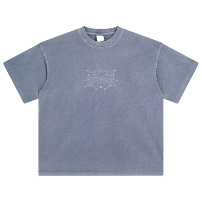 Blue washed oversized t-shirt with aviation-inspired line art graphic on chest.