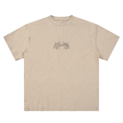 Tan streetwear t-shirt with black linework graphic on chest, short sleeves, modern fit