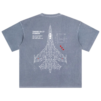 Blue t-shirt with white Sukhoi Su-27 fighter jet blueprint graphic and red stars on back.